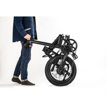 Load image into Gallery viewer, Qualisports Dolphin 350-watt electric foldable bike folded and walked by its seat.